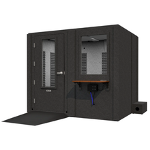 Load image into Gallery viewer, Angled front-right view of the Audiology Premium package by WhisperRoom, highlighting the single-wall ADA-compliant booth with closed door and observation window
