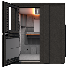 Load image into Gallery viewer, Front view of the WhisperRoom Creator Deluxe sound booth with the door open, showing the interior workspace inside the 6' x 6' double-wall booth.