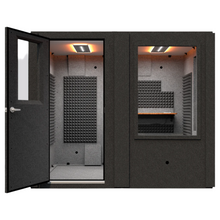 Load image into Gallery viewer, Front view of the WhisperRoom Meeting Booth with the door open, showing the 6' x 8' single-wall layout, large interior desk, studio lighting, and dual 48" windows for visibility.