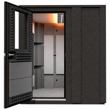 Load image into Gallery viewer, Front view of the WhisperRoom Practice Deluxe sound booth with the door open, showing the interior acoustic treatment, bass traps, and studio light inside the 6' x 6' double-wall enclosure.