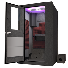 Load image into Gallery viewer, Angled view of WhisperRoom's Voice Over Basic Package - a 4' x 4' single-wall vocal booth, meticulously designed with acoustic treatment, a functional desk, studio lighting, and a comprehensive range of premium features. The left-hinged door is open, revealing the interior enhanced by sophisticated burgundy StudioFoam, creating an ideal recording atmosphere.
