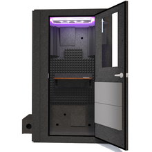 Load image into Gallery viewer, Front view of the WhisperRoom's Voice Over Basic Package - a 4' x 4' single-wall vocal booth, meticulously designed with acoustic treatment, a functional desk, studio lighting, and a range of premium features. The right-hinged door is open, revealing the interior adorned with sophisticated gray StudioFoam, creating an optimal recording environment.