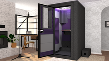 Load image into Gallery viewer, WhisperRoom's Voice Over Deluxe Package: A 4'x4' Double-Wall Vocal Booth equipped with Bass Traps, a Folding Office Desk, Purple Auralex StudioFoam, an Exterior Fan Silencer, Multi-Colored LED Studio Light, and an Acoustic Package, perfectly integrated into a living room home recording studio setup next to a fireplace with a chair at a desk, a laptop, and a complete various other equipment for voiceover.