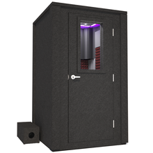 Load image into Gallery viewer, Frontal view of WhisperRoom's Voice Over Deluxe Package - a 4' x 4' double-wall vocal booth, meticulously designed with acoustic treatment, a functional desk, studio lighting, and a comprehensive range of premium features. The right-hinged door is closed, and the interior is enhanced by sophisticated burgundy StudioFoam, creating an ideal recording environment.