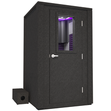 Load image into Gallery viewer, Frontal view of WhisperRoom's Voice Over Deluxe Package - a 4' x 4' double-wall vocal booth, meticulously designed with acoustic treatment, a functional desk, studio lighting, and a comprehensive range of premium features. The right-hinged door is closed, and the interior is enhanced by elegant purple StudioFoam, creating an ideal recording environment.
