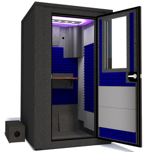 Angled view of the WhisperRoom's Voice Over Deluxe Package - a 4' x 4' double-wall vocal booth, meticulously designed with acoustic treatment, a functional desk, studio lighting, and a comprehensive range of premium features. The right-hinged door is open, and the interior is accentuated with vibrant blue StudioFoam, creating an ideal recording environment.