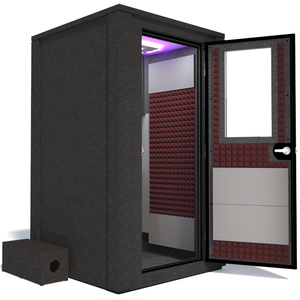 Side view of the WhisperRoom's Voice Over Deluxe Package - a 4' x 4' double-wall vocal booth, thoughtfully equipped with acoustic treatment, a functional desk, studio lighting, and an array of premium features. The right-hinged door is open, revealing the interior enhanced by sophisticated burgundy StudioFoam, creating an ideal recording atmosphere.