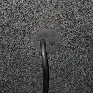 A cable passage plug on a WhisperRoom wall