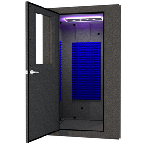 A WhisperRoom MDL 4848 S shown from the front with the door open and a studio light inside. 